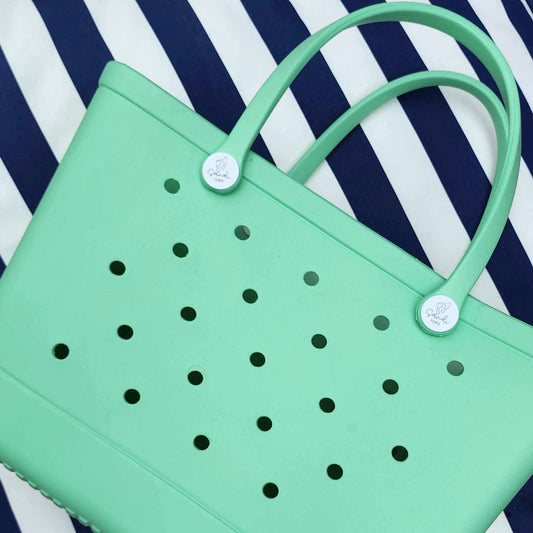 Sea Foam Silicone Bag showing a side with logo buttons