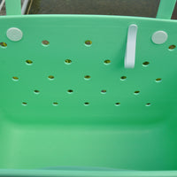 "Sea Foam Eva Silicone bag showing the clip for sunglasses keys etc."