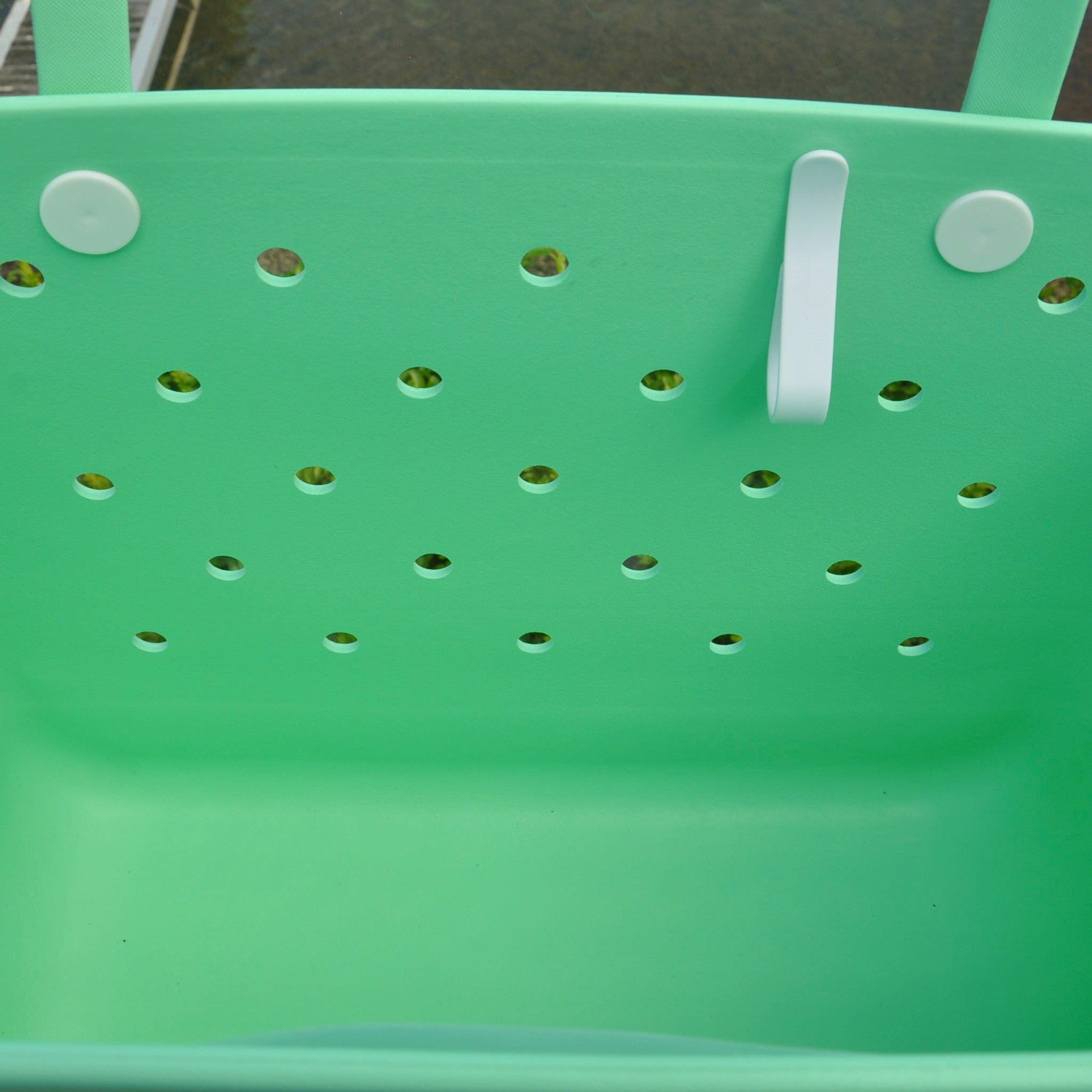 "Sea Foam Eva Silicone bag showing the clip for sunglasses keys etc."