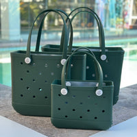 * "All three Sea Moss EVA silicone beach tote bags front view The Hauler, The Everyday and The Mini, showing size, Sandi Toes buttons, and sturdy handles"