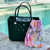 * "Sea Moss Eva Silicone bag showing the a Turtle Cove Sand Free Hoodie for kids."