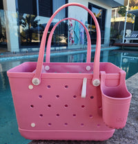 Sea Shell Tote Bag with Silicone Cup holder and key clip beside a swimming pool