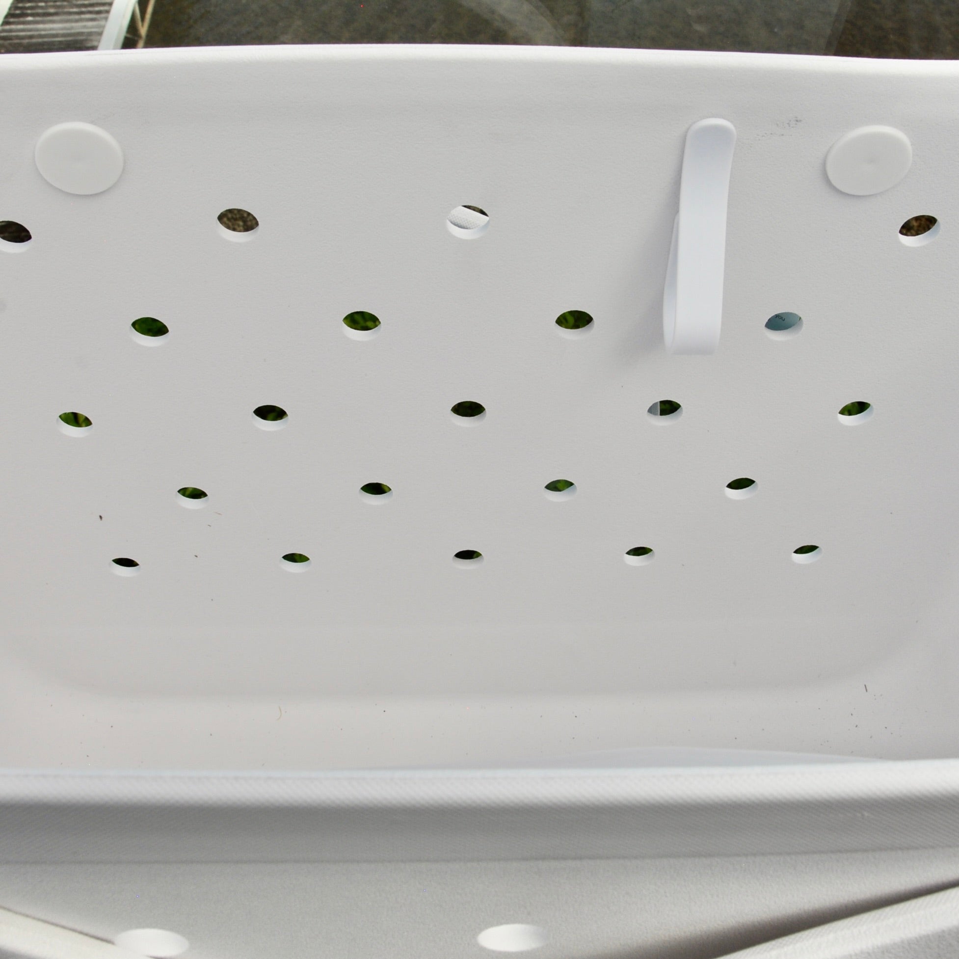 "White Haven Eva Silicone bag showing the clip for sunglasses keys etc."