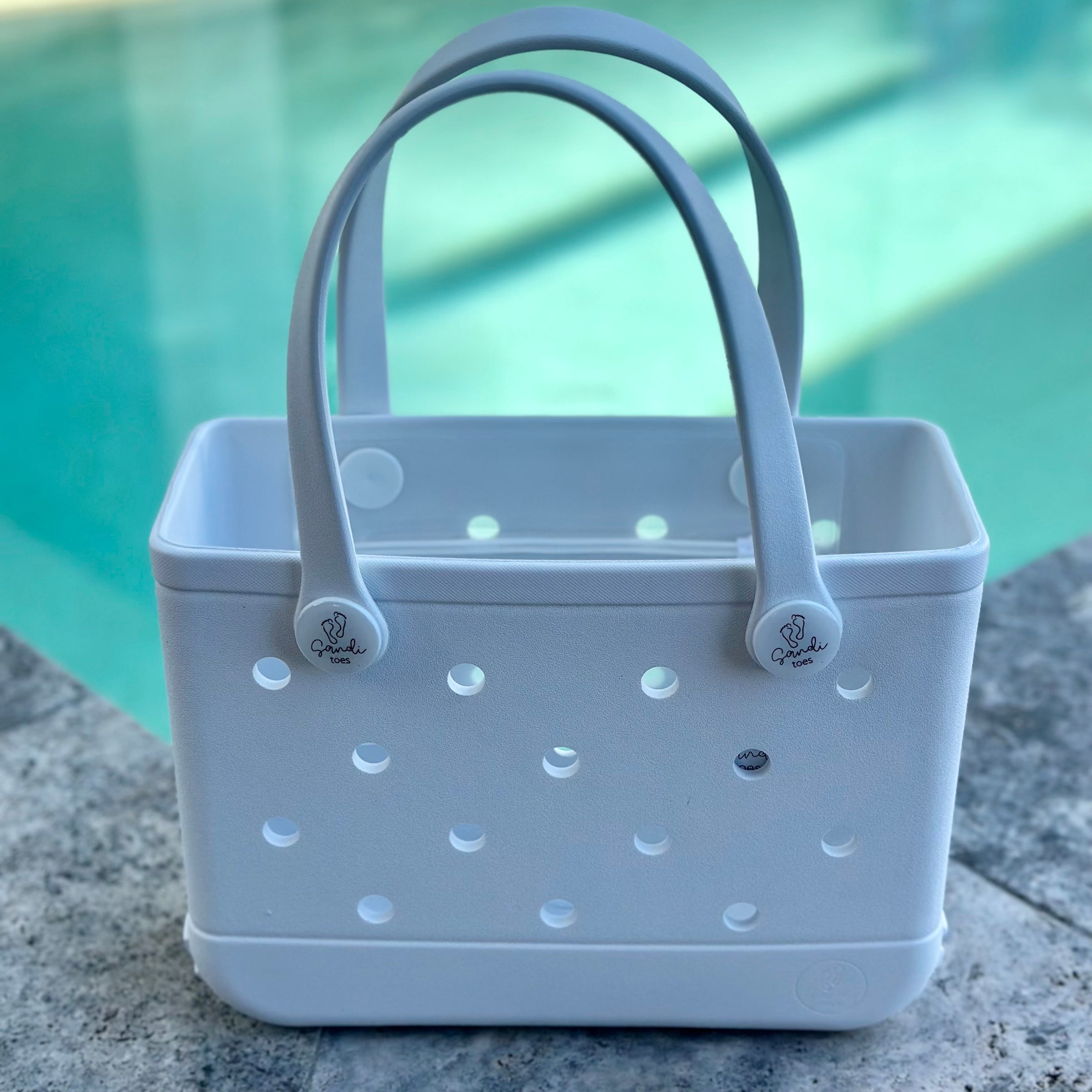 * "Small White Haven EVA silicone beach tote bag front view showing compact size and handles"