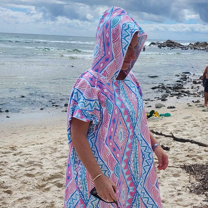 Xalli Sand-Free Hoodie (One Size Fits All): Beach Chic at Hastings Point. [Adult female with the hood over her head protecting from the suns harmful rays in stylish Xalli hoodie takes in the vast ocean view at Hastings Point, NSW.]