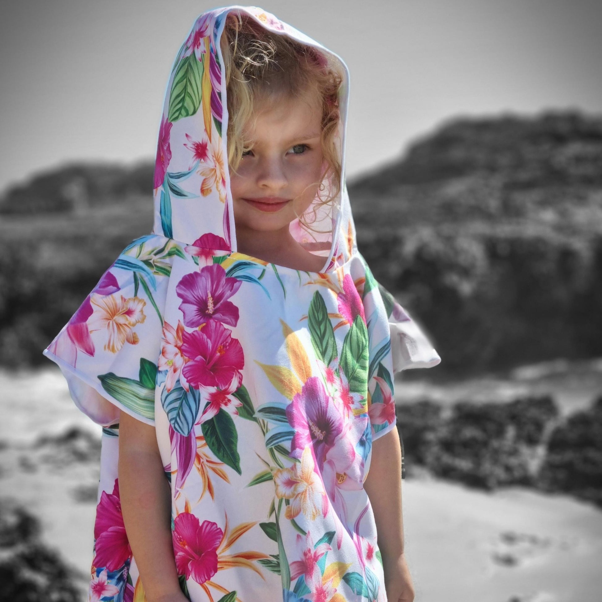 Sand Free Beach Towel with 3 year old girl with Hibiscus flowers on a predominately white sand free beach towel