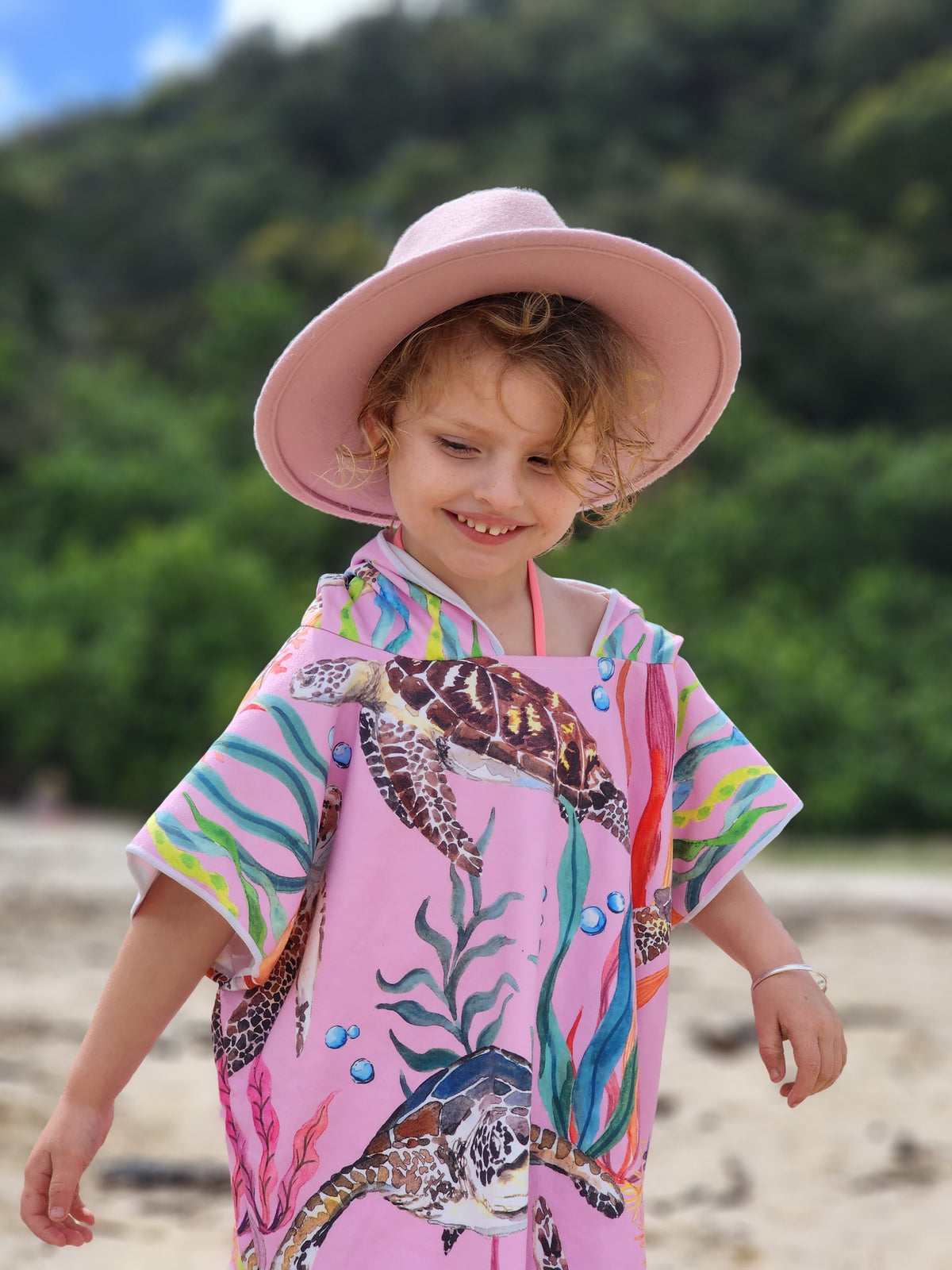 My Free Spirit, wearing her Turtle Cove sand free hooded towel