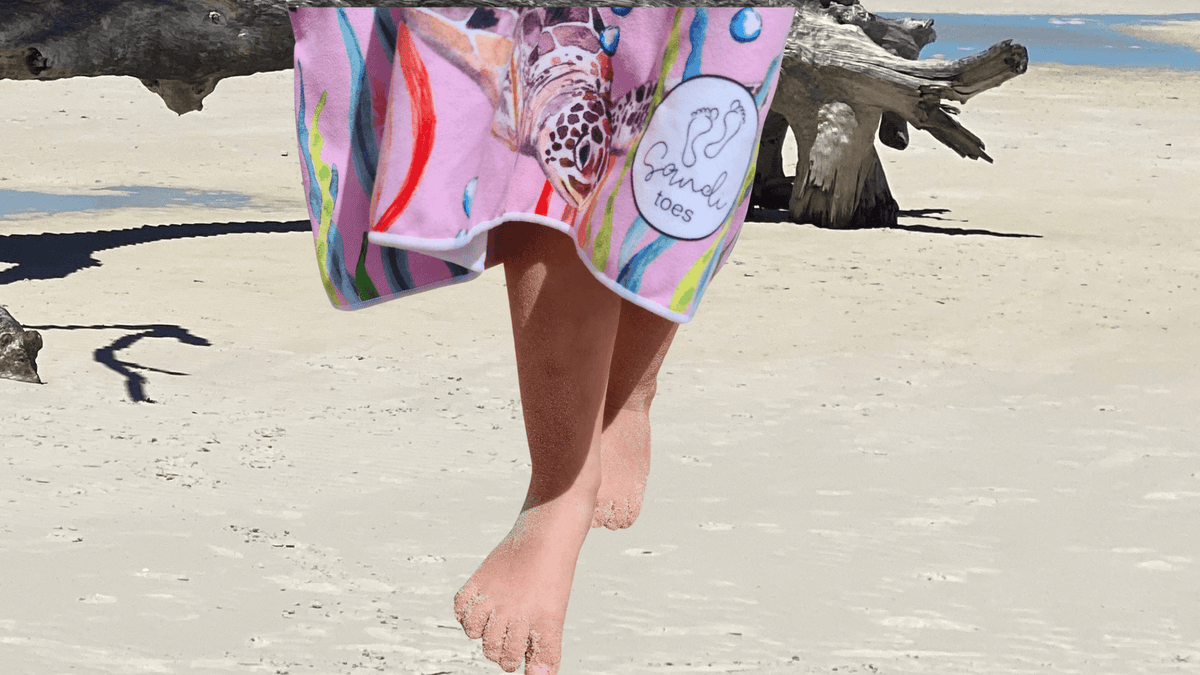 Sandi Toes on the beach at White Haven beach in the Whitsundays north queensland, Turtle Cove