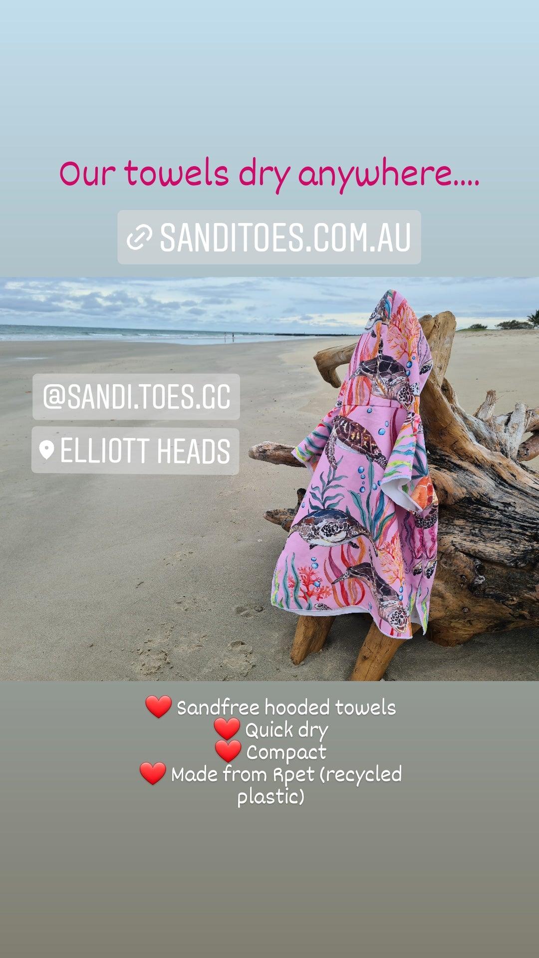 Drying at Elliott Heads is our Turtle Cove Hooded Beach Towel, it is hanging on beach driftwood