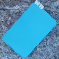Aqua Marine Bag Divider with clips on a textured surface