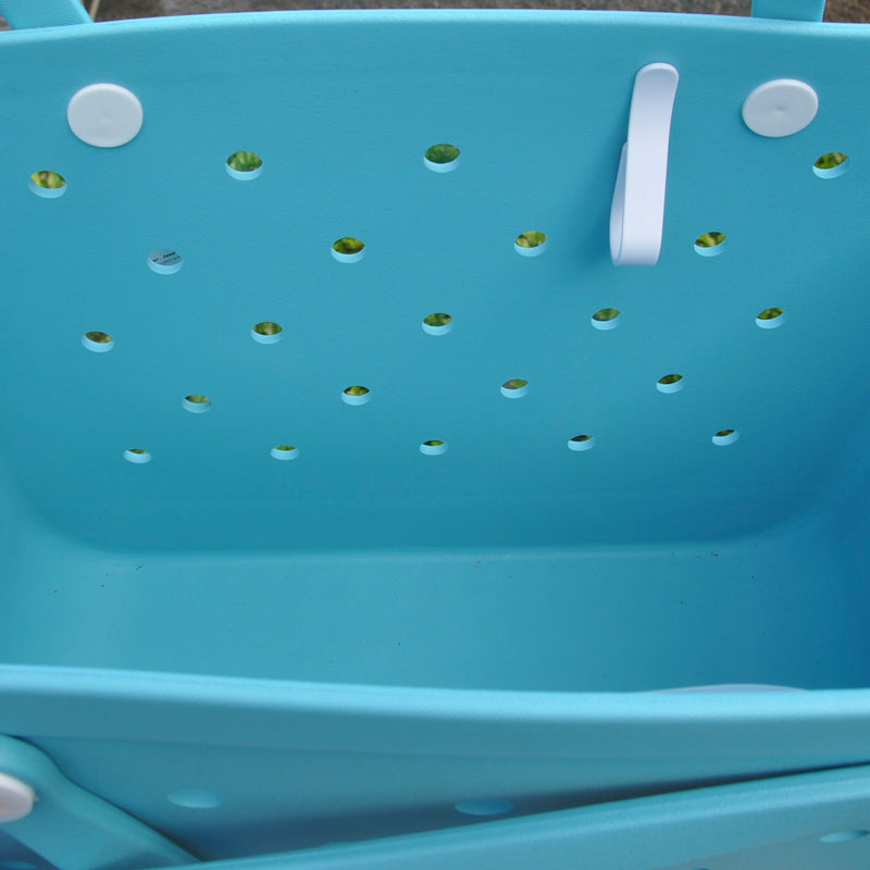  "Aqua Marine Eva Silicone bag showing the clip for sunglasses keys etc."
