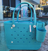 Aqua Marine Tote Bag with Silicone Cup holder and key clip beside a swimming pool