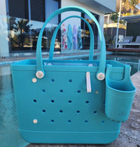 Aqua Marine Tote Bag with Silicone Cup holder and key clip beside a swimming pool