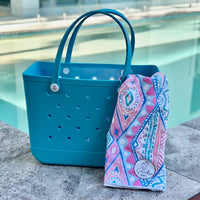  "Aqua Marine Eva Silicone bag showing the a Xalli Sand Free Hoodie for adults"
