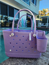 Coral Cove Tote Bag with Silicone Cup holder and key clip beside a swimming pool