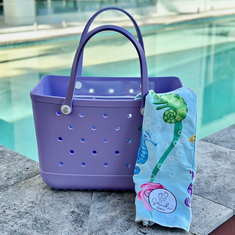 * "Coral Cove Eva Silicone bag showing the a Earth and Sea Sand Free Hoodie for kids."