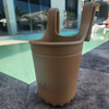 EVA Silicone Sand cup holder on a stone surface near a pool