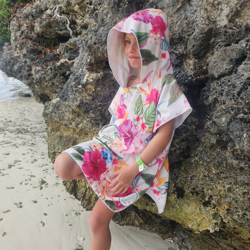 Girl on the beach wearing Island Princess sand-free hoodie