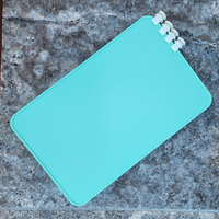 Sea Foam Bag Divider with clips on a concrete pool surface