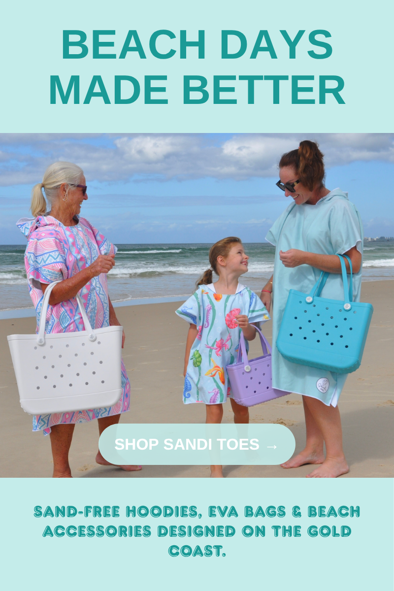 Three generations on the beach wearing Sandi Toes sand-free hooded towels and carrying EVA beach bags