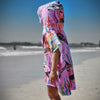 Standing on Currumbin Beach a three Year old girl watching the waves roll in her Turtle Cove sand free beach towel